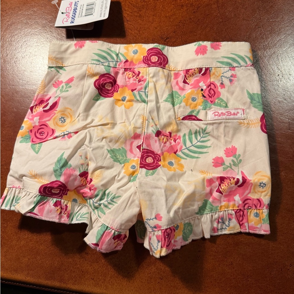 NWT Floral RuffleButts shorts. Size 3